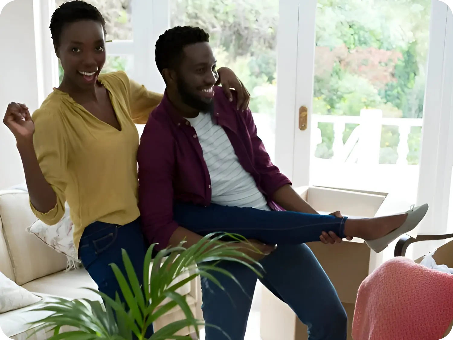 A man and woman sitting on the ground.