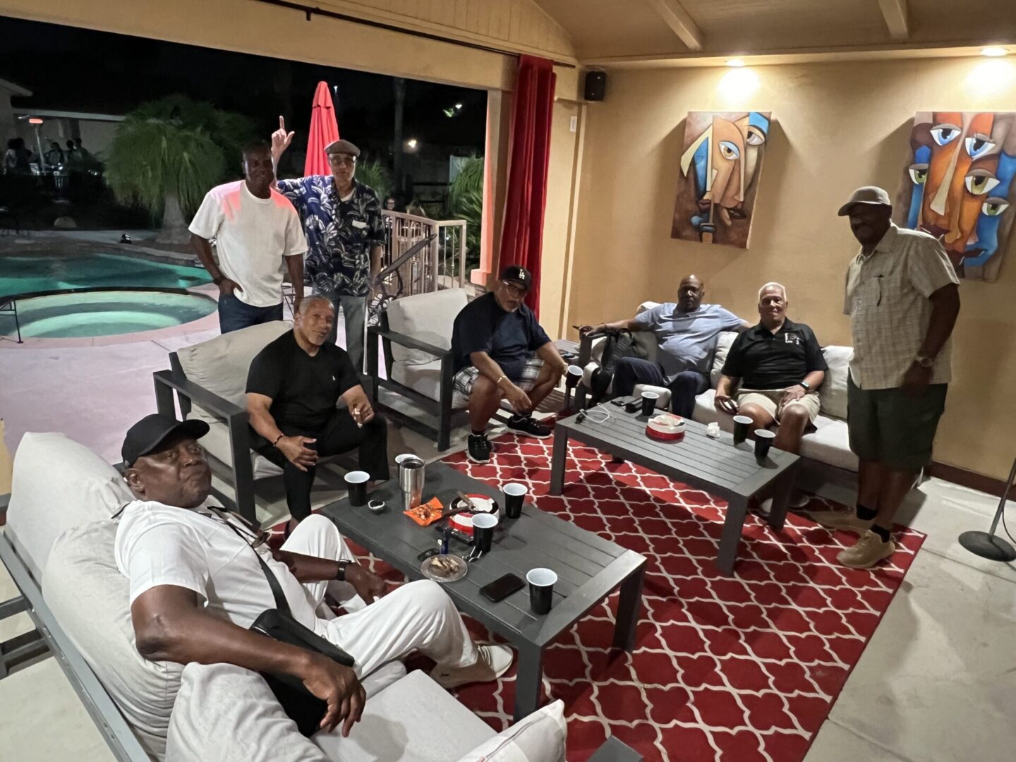 A group of men sitting on couches in a room.